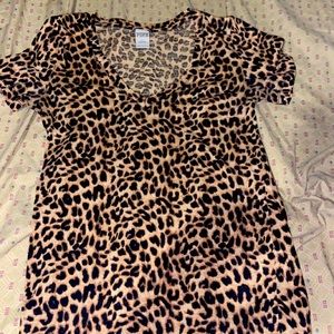 Pink small v neck shirt.